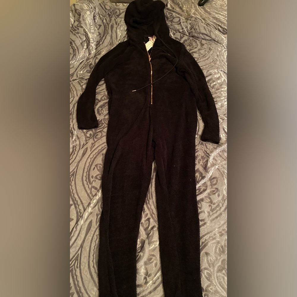 This jumpsuit is called pet me heart pocket onesie it’s from Lizzos yitty brand